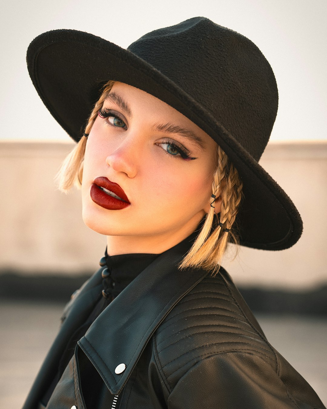 Home a-woman-wearing-a-black-hat-and-red-lipstick-phvuyex5-os
